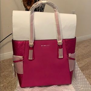 Never worn Michael Kors large ultra pink voyager